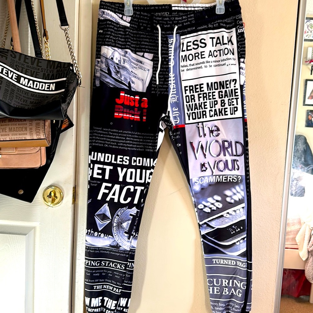 A pair of men joggers with money graphics on them